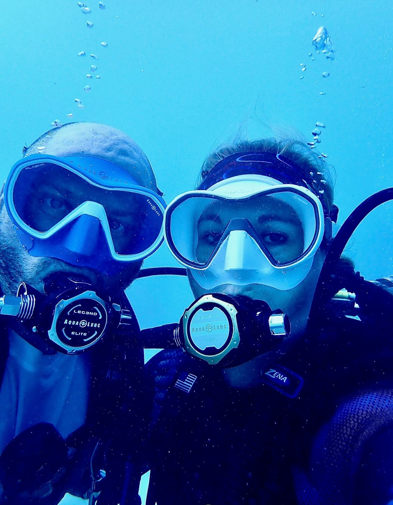 Chad and Jessica Hanjora training divers in crystal clear water
