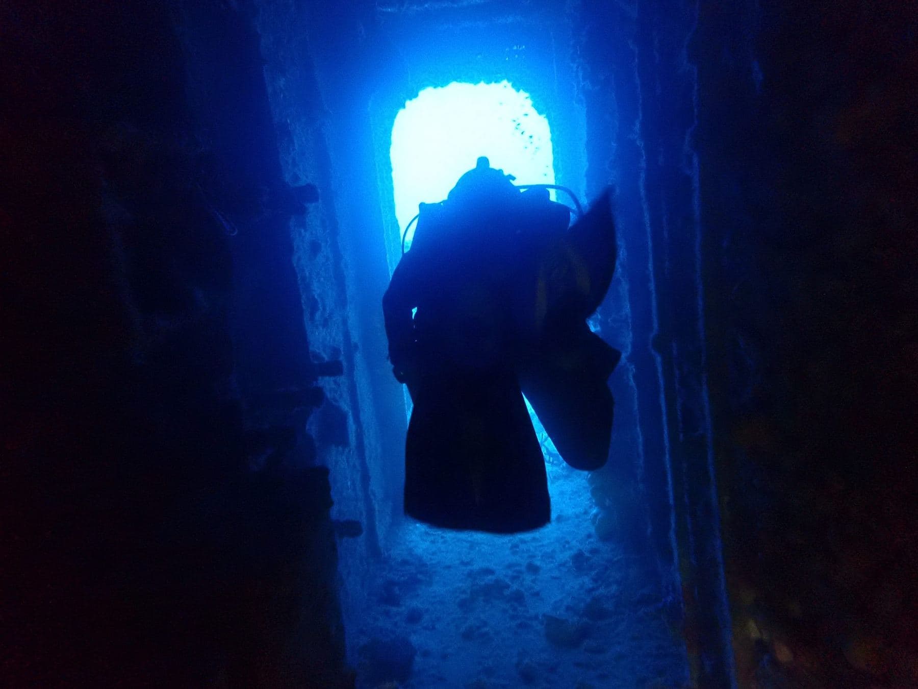 A doorway lit from the other side