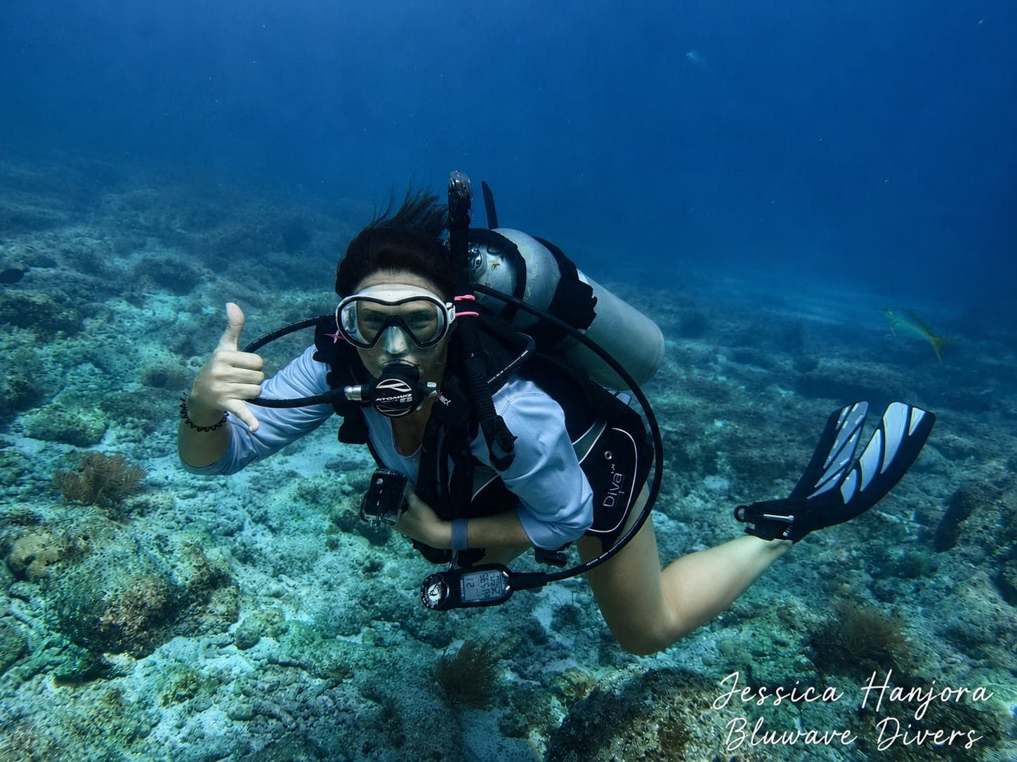 Thumbs up over the reef