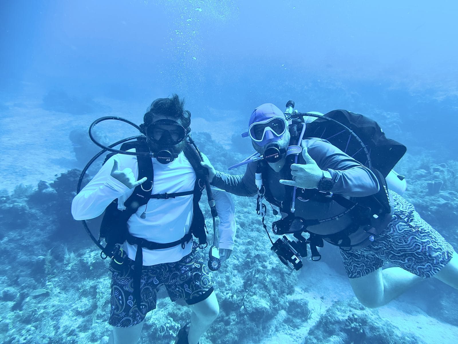 Two shakas on the reef